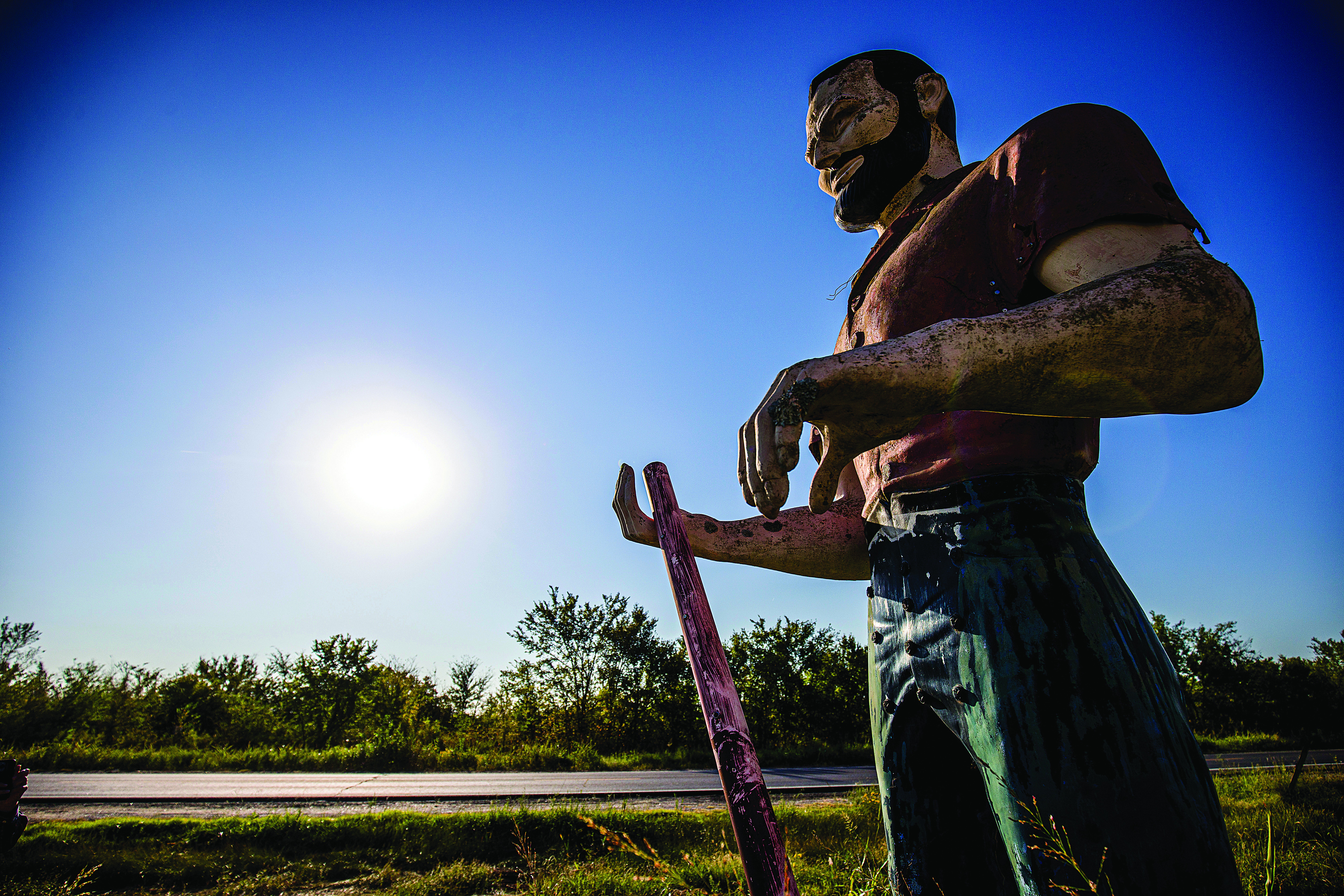 caption:This junkyard muffler man is located in Oktaha, about 3 miles south of Muskogee, on an old stretch of the Jefferson Highway that is now part ofU.S. Highway 69. Photo by Shane Bevel