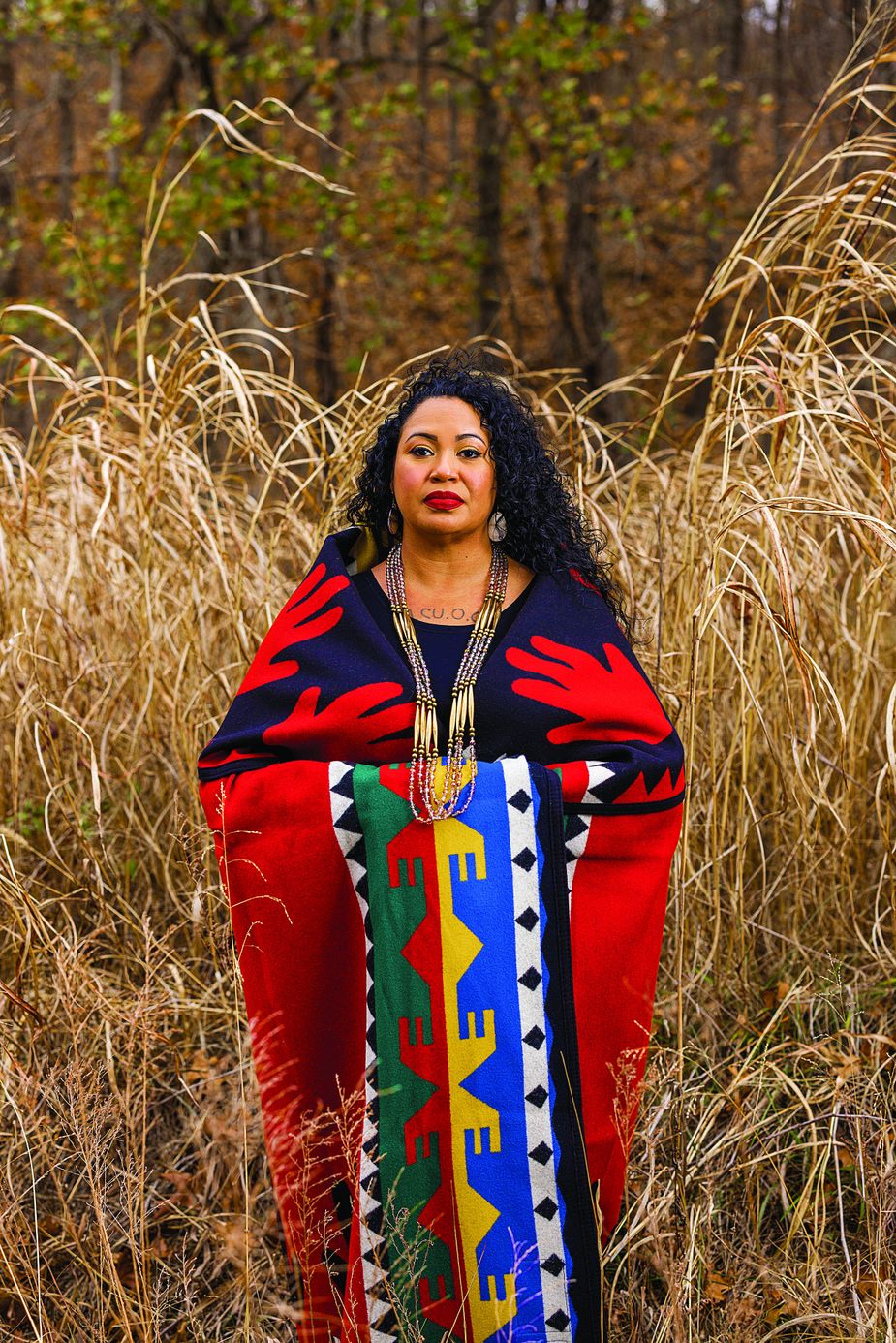 Most mornings, Dana Bear, director of birth work at Burning Cedar Sovereign Wellness, prays at the shore of Hudson Lake, not far from Bartlesville and close to her ancestors’ reservation boundaries. Photo by Valerie Wei-Haas