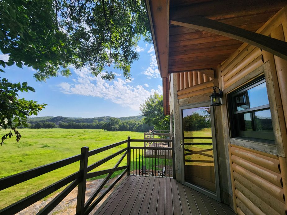 The two decks at the Tree House offer sweeping views of the seventy-acre property. Photo by Megan Rossman