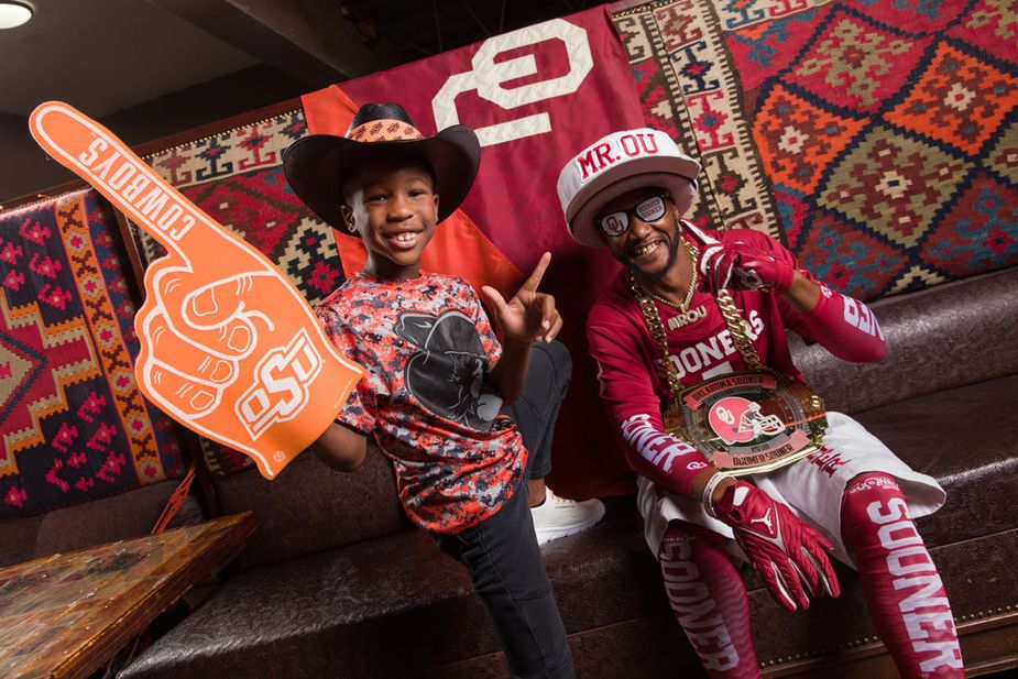 Warren the Cowboy and Mr. OU root for their respective teams at Bedlam Bar-B-Q in Oklahoma City. Photo by Brent Fuchs