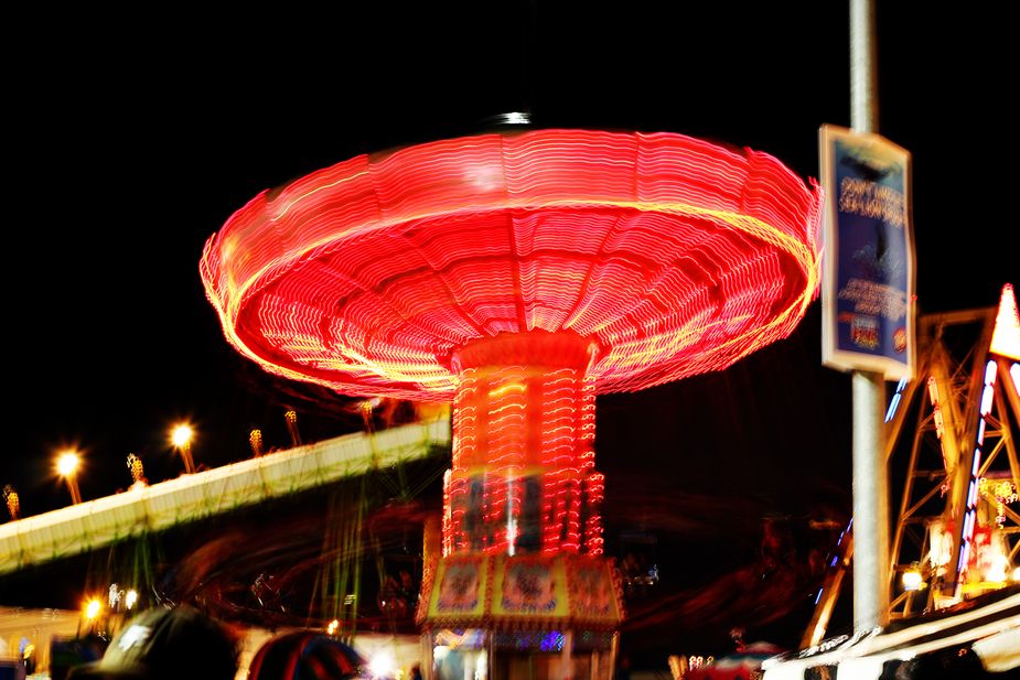 The Oklahoma State Fair takes on a new magical look once the sun goes down. Photo by Nathan Gunter