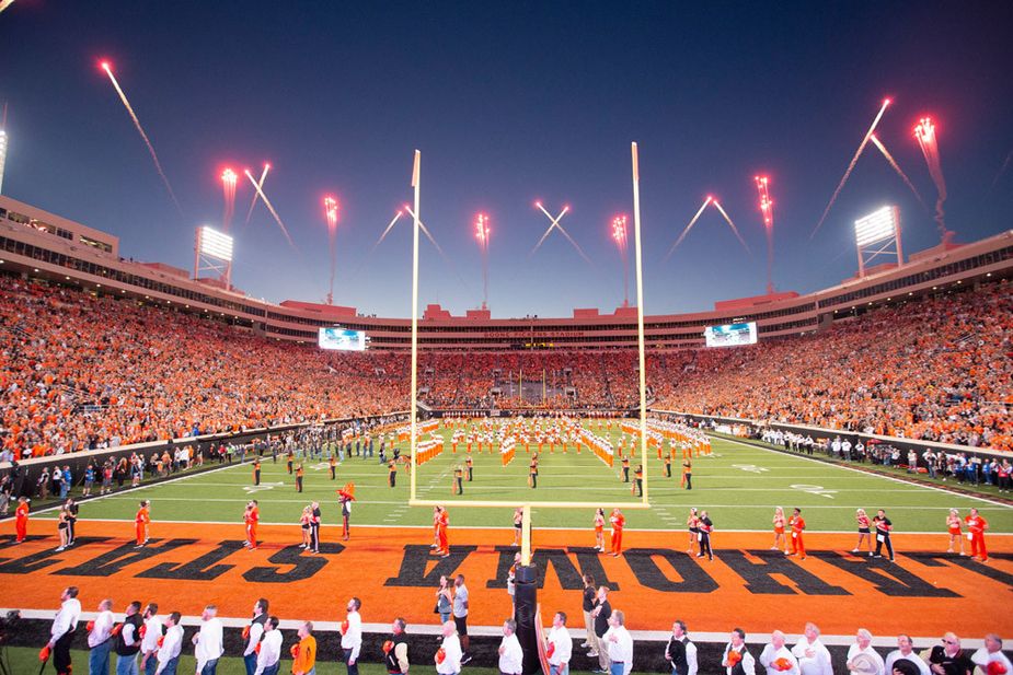 The crowd pauses for the National Anthem at Boone Pickens Stadium in Stillwater. Photo courtesy Bruce Waterfield/OSU Athletics