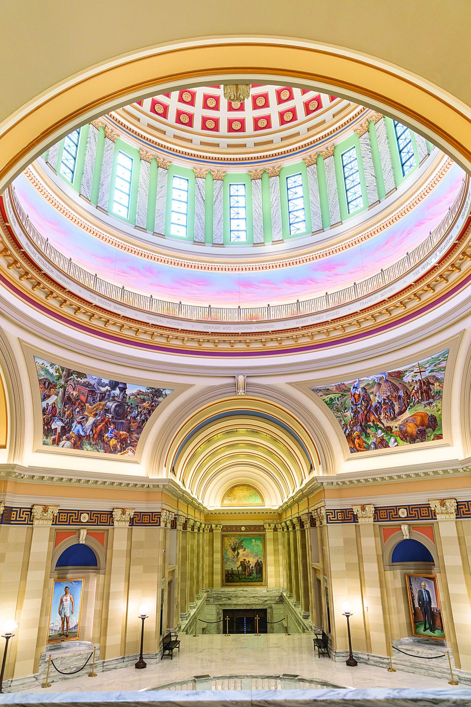 Shawnee artist Lucas Simmons, left, helped install the first piece in his ground-floor mural series "Labor Omnia Vincit" in August 2022. Photo courtesy Oklahoma Legislative Service Bureau](https://d1nyedprbrntd2.cloudfront.net/Capitol%20Gains%20B220825a-31_1.jpg)![The Oklahoma State Capitol dome contains numerous works of art. Photo courtesy Oklahoma Legislative Service Bureau