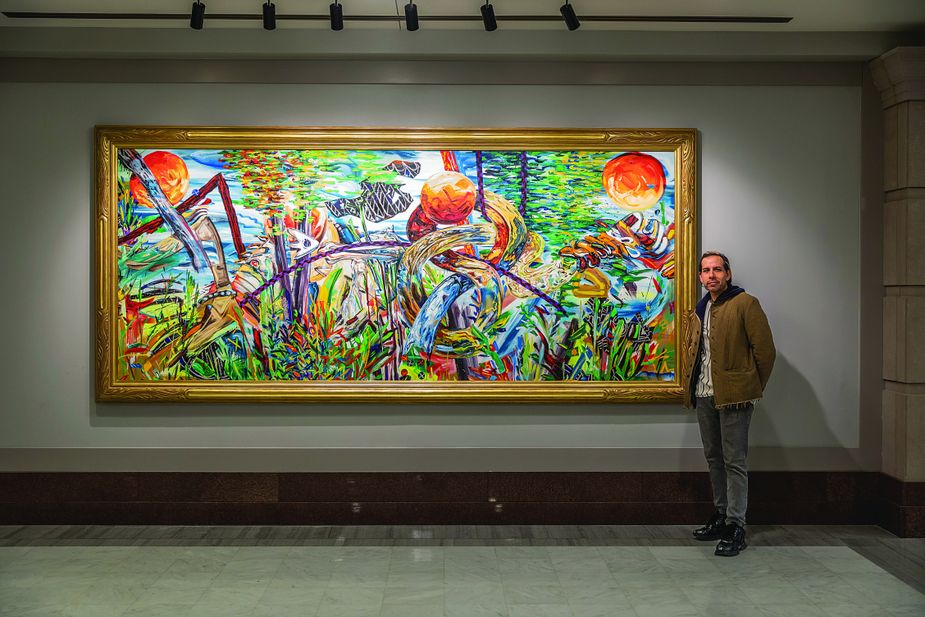 Artist Yatika Starr Fields with his painting "Spiro: Serpent River, Shelled Stories, Sun-Touched Engravings." Photo courtesy Oklahoma Legislative Service Bureau