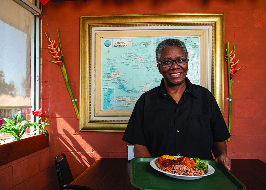 Sharon McMillan serves all of her featured entrées—goat, lamb, oxtail, and chicken—either curried or jerk-style with two sides like mac and cheese and red beans and rice. Photo by Lori Duckworth