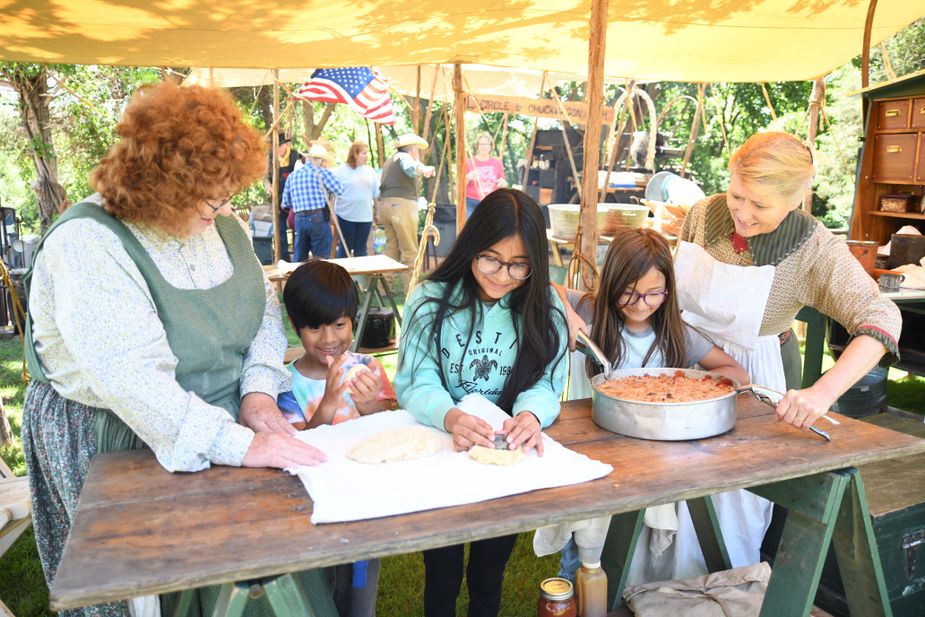 Visitors to the Chuck Wagon Festival at National Cowboy and Western Heritage Museum get hands-on experience in frontier living. Photo courtesy National Cowboy and Western Heritage Museum
