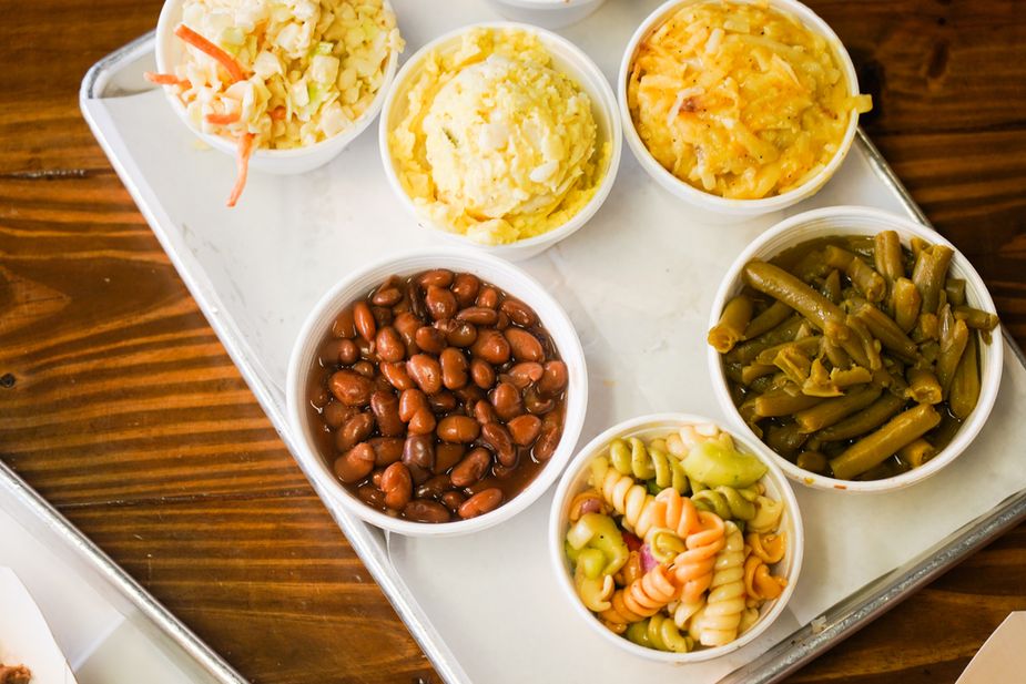 Sides like barbecue beans, pasta salad, potato salad, and the beloved campfire potatoes are far from an afterthought at Mac's. Photo by Laci Schwoegler/Retrospec Films