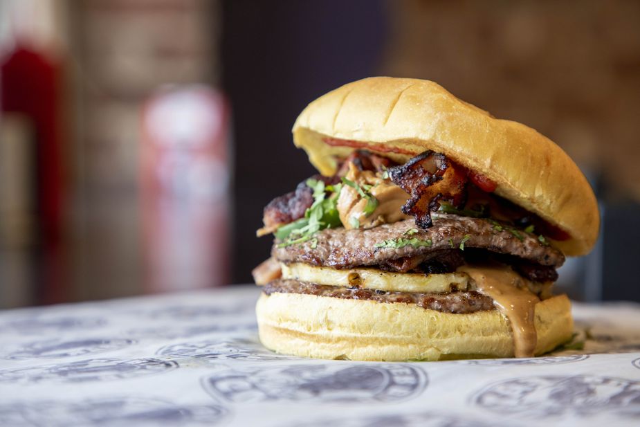 The Peanut Butter & Bacon Burger at Fat Guys Burger Bar is a self-explanatory delicious mess of a meal. Photo by Lori Duckworth