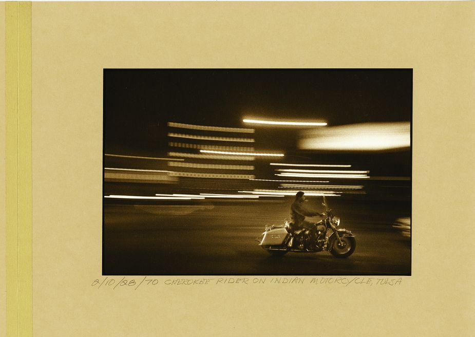 A man rides an Indian motorcycle through Tulsa, 1970 Photo by G. Oscar Herron