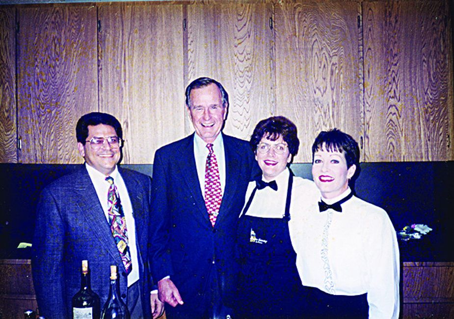 Tex Slyman, President George H.W. Bush, Melissa Chapman, and Leslie Holler. Photo courtesy the Slyman family