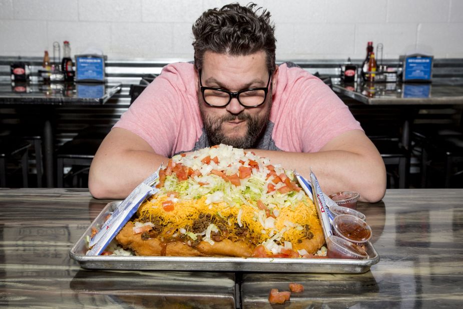 Greg contemplates the thirteen-pound Indian taco at The Miller Grill in Yukon. For this challenge, customers are allowed to recruit a friend to help chow down. Photo by Lori Duckworth