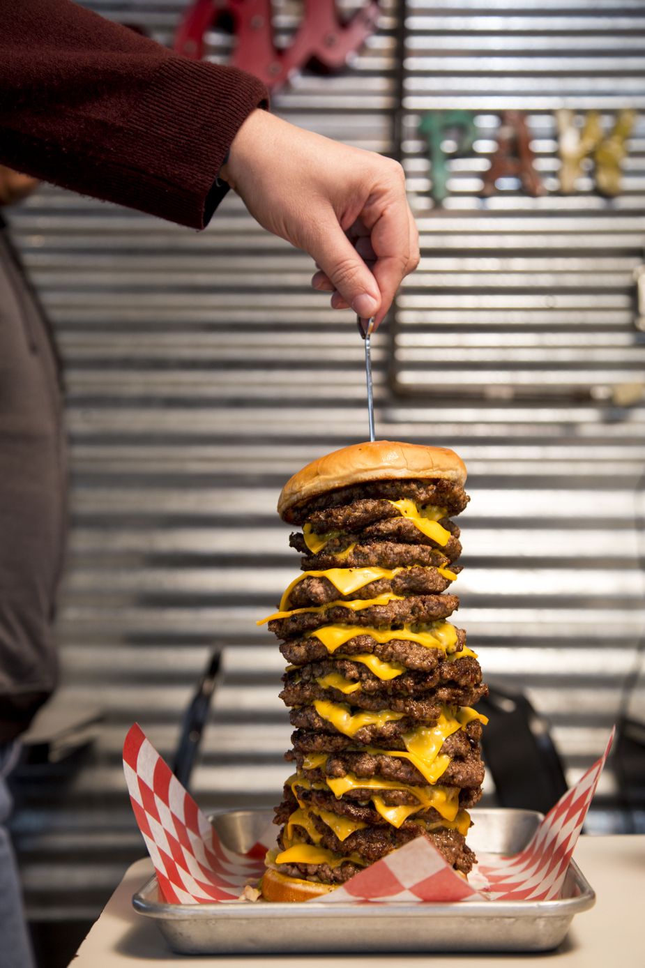 Buns, cheese, toppings, and seventeen beef patties make up the Paw Paw's Burger Challenge. At this Chickasha restaurant, eaters receive the burger and a T-shirt for free if they finish in less than thirty minutes. Photo by Lori Duckworth