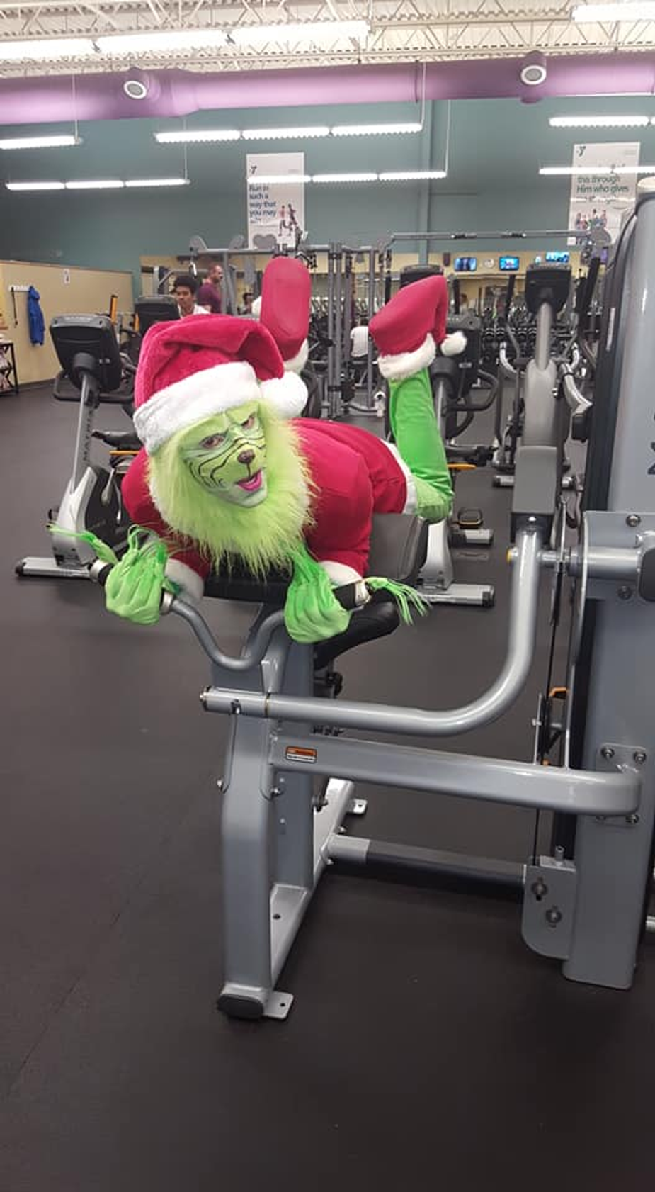 The Grinch is working out to get ready for the Shawnee Family YMCA's Supper with Santa and The Grinch. Photo by Brandon Bell.