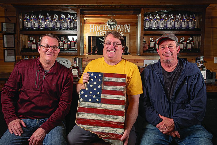 Mitchell, Tommy “Blue,” and Mark McDaniel of the Hochatown Distilling Company and Mountain Fork Brewery know that a good drink keeps tourists and locals coming back for more. Photo by Lori Duckworth