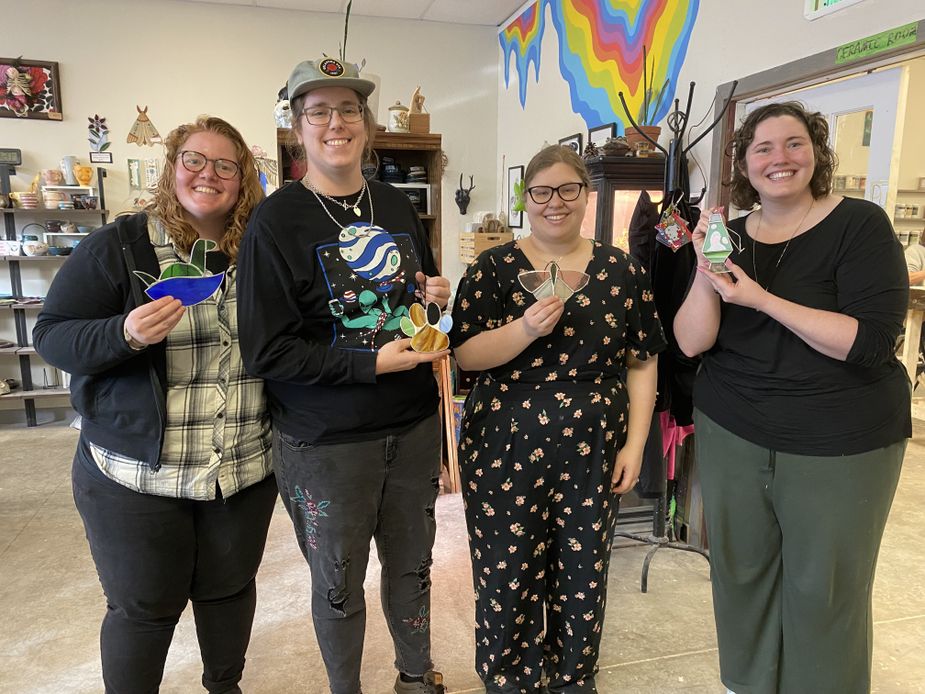 Karlie (far right) and friends show off their creations