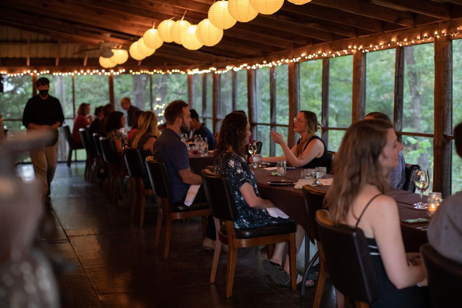 The communal dining table at Living Kitchen in Depew allows guests to share the experience together. Photo by Valerie Wei-Haas