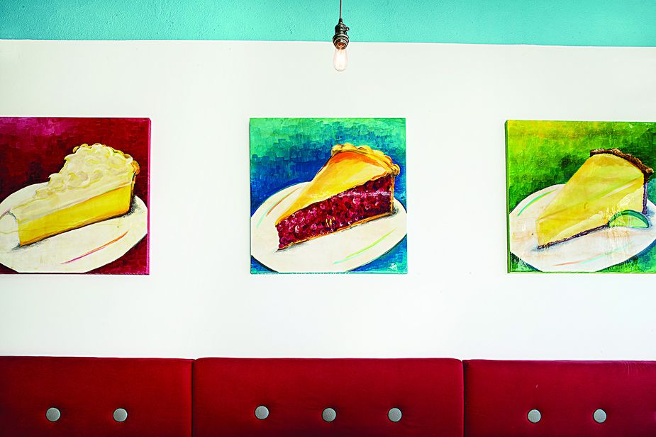 Colorful pie art adorns the walls at Pie Junkie’s Plaza District location.