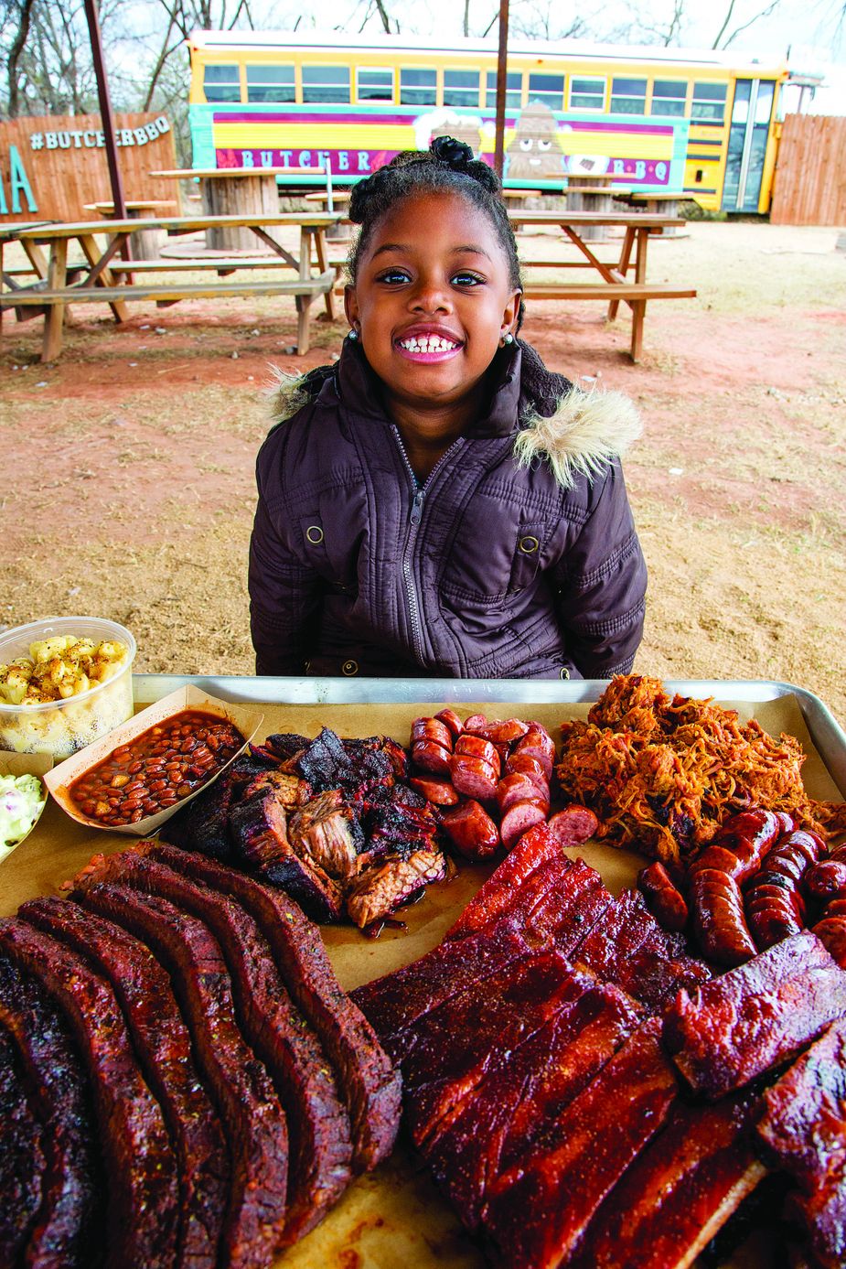 Capable of feeding an entire family, the Meat Locker at the Butcher BBQ Stand comes with brisket, ribs, pulled pork, chicken, smoked sausage, smoked hot links, burnt ends, three sides, dessert, and bread. Photo by Lori Duckworth