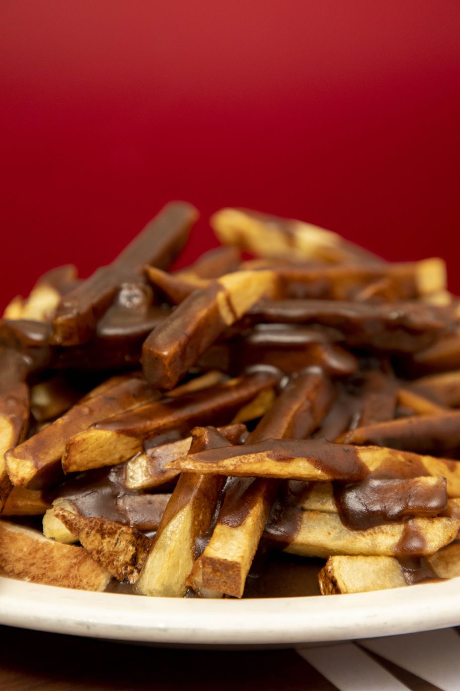 There is indeed a burger hiding under the gravy-drenched pile of fries at Murphy’s Steak House in Bartlesville. The Hot Hamburger is the restaurant’s most famous menu item. Photo by Lori Duckworth