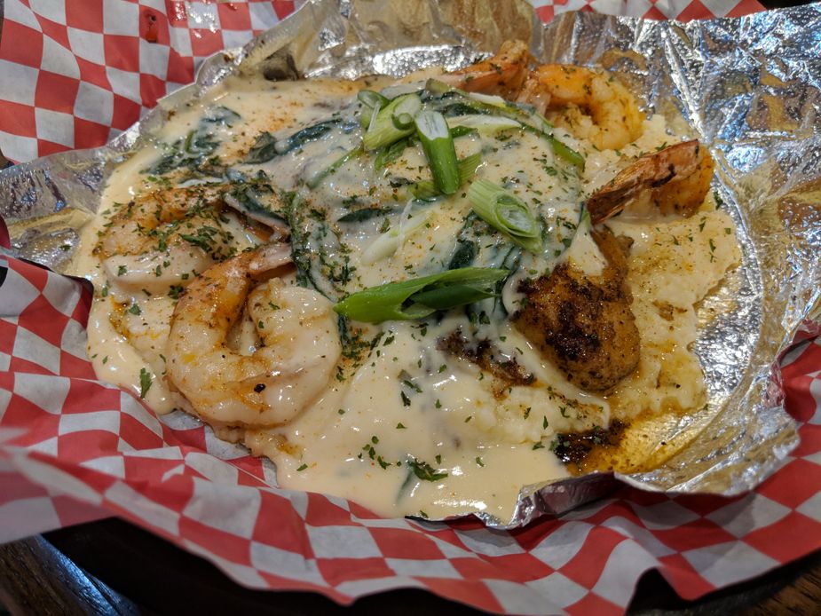 Off The Hook in Oklahoma City serves shrimp, catfish, and grits smothered in a lobster cream sauce. Photo by Greg Elwell