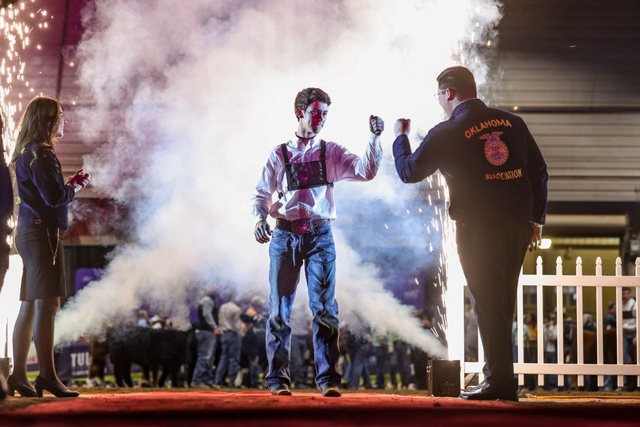 Cooper Kline, right, bumps fists with Kelton Arthur, a fellow Oklahoma FFAer, at the 2024 Tulsa State Fair Livestock Exhibitors Night of Champions, an event that honors 150 4-H and FFA students from around the state. Photo courtesy Next Level Images / Tulsa State Fair