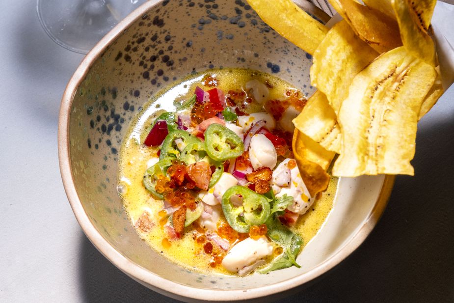 The coconut milk scallop ceviche bring delectable pops of color to the demure atmosphere at Perle Mesta. Photo by Lori Duckworth