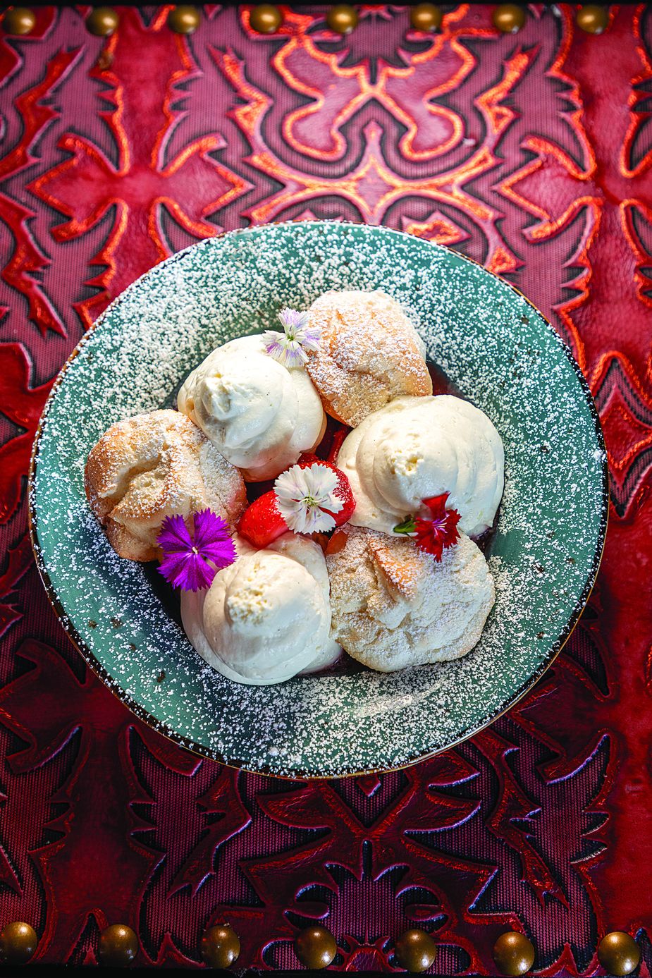 The strawberry shortcake is made with angel food cake dumplings, macerated strawberries, and puffs of whipped cream. Photo by Lori Duckworth