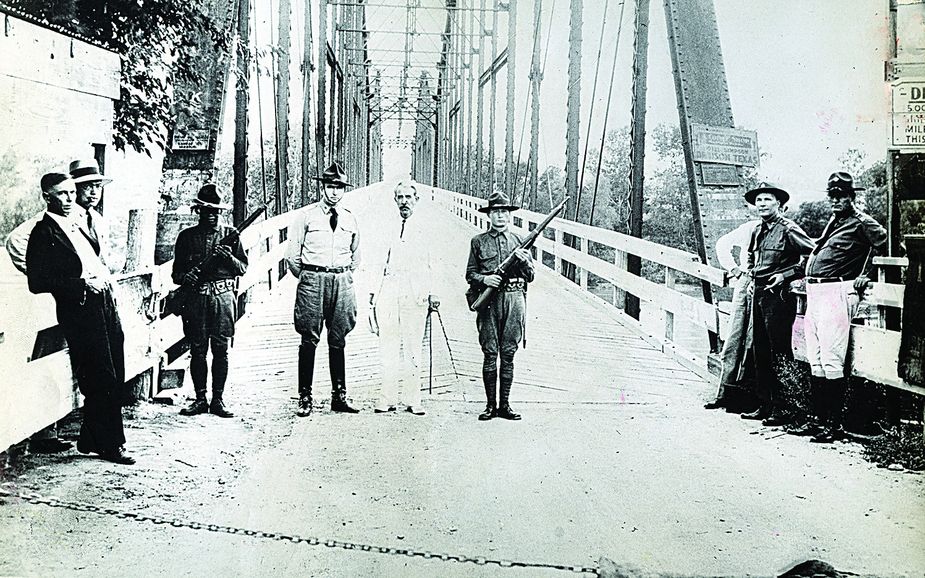 Governor Murray and the Oklahoma National Guard block traffic on the Red River bridge. Photo courtesy Oklahoma Historical Society