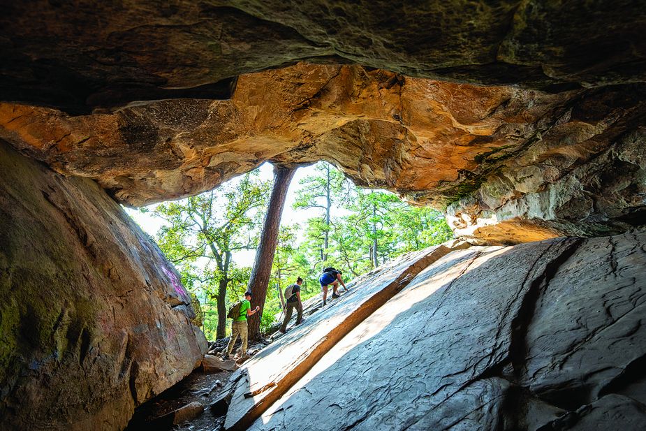 A short but vigorous jaunt through boulders and hardwood forest takes visitors to Robbers Cave State Park’s namesake attraction. Photo by Lori Duckworth