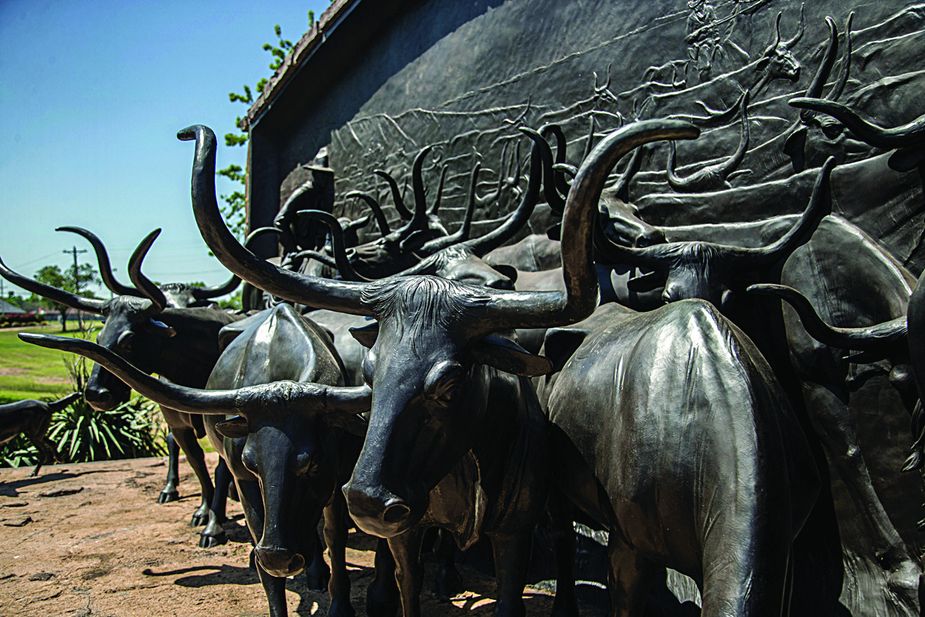 On the Chisholm Trail is a life-size, 34-foot long sculpture by Paul Moore that sits outside the Chisholm Trail Heritage Center in Duncan.