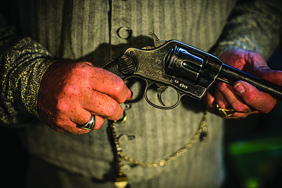Doug Davis of Hitchcock shows off a replica of Theodore Roosevelt’s pistol he had custom engraved.