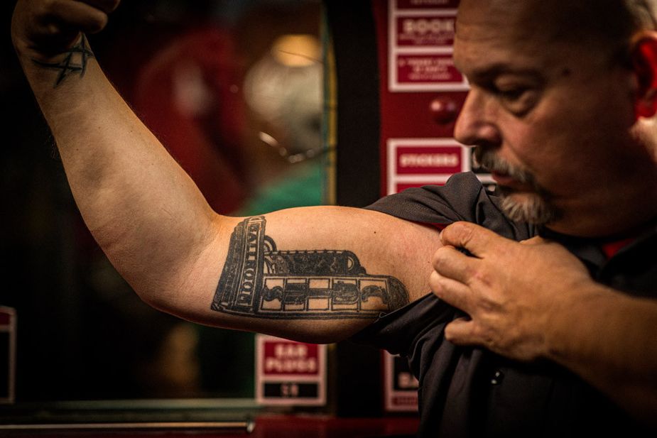 Longtime employee Shawn Emig shows off his Cain’s tattoo. He's been working at the venue and attending shows there since 1984.  Photo by Shane Bevel