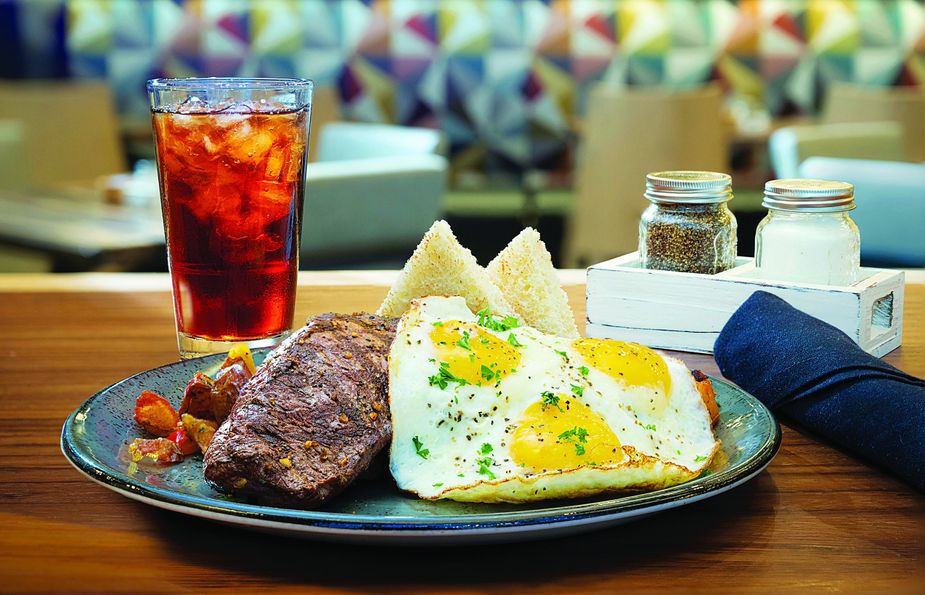 Treating yourself to a sumptuous breakfast is easy with dishes like the Butcher's Steak and Eggs at Salt & Stone. Photo by Jason Ward