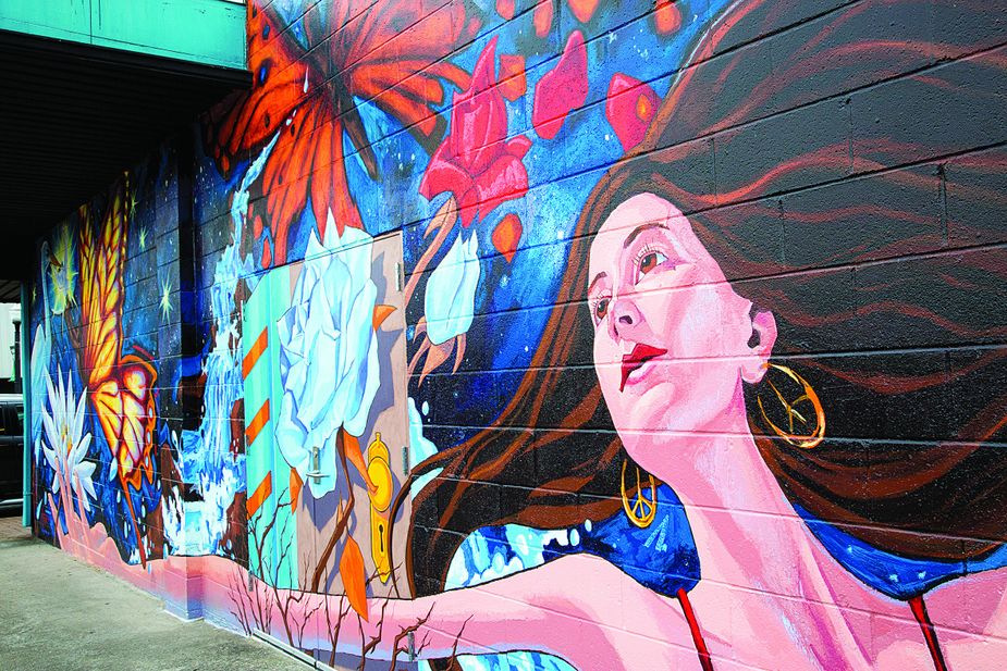 Reaching for Peace—designed by Northeastern State University art professor Lance Hunter and painted with the help of students—adorns the exterior of the NSU Art Gallery in downtown Tahlequah.