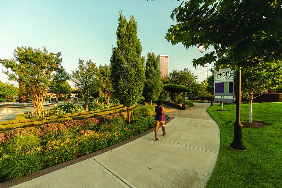 A visitor explores John Hope Franklin Reconciliation Park.  Photo by Shane Bevel