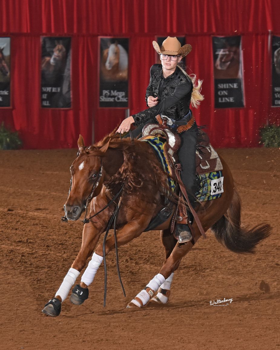 Control is the name of the game as riders direct their steeds in the Tulsa Reining Classic. Photo by Dick Waltenberry