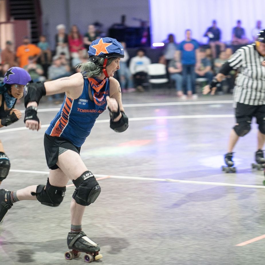 Whether they're throwing kisses to the crowd or elbow as their opponents, it's always fun on wheels at the Twister City Roller Derby in Edmond. Photo courtesy Twister City Roller Derby