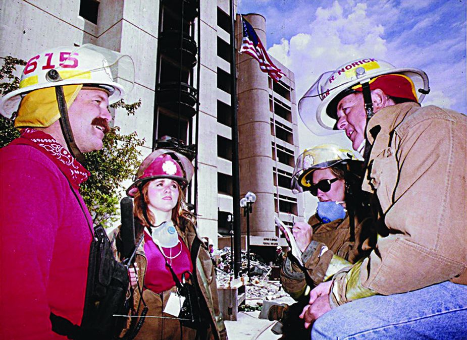 Carrie Hulsey-Greene, left of center, reporting in front of the Murrah Building in 1995. Photo by David McDaniel/Oklahoma Publishing Company.