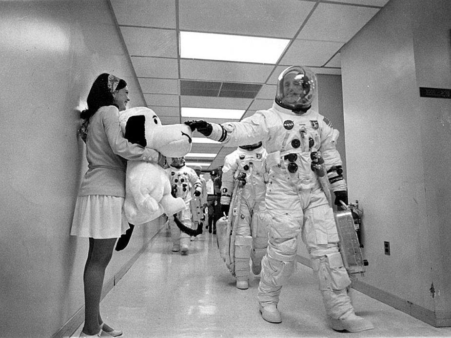 Stafford pats a plush Snoopy—the lunar module’s nickname—on the way to the Apollo 10 launch pad. Peanuts creator Charles M. Schulz created special artwork for the mission. Photo courtesy NASA