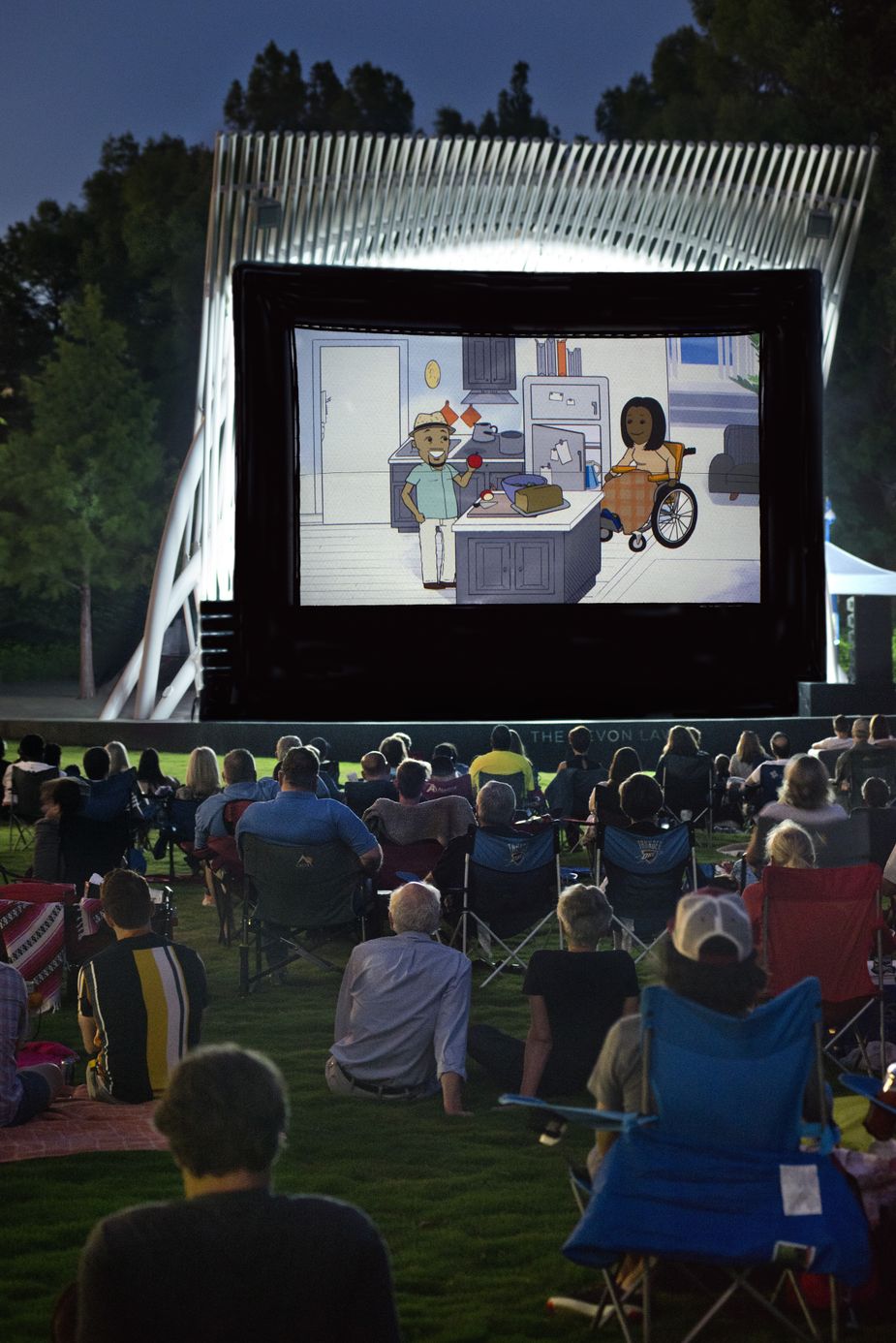 In years past, hundreds of visitors brought lawn chairs, blankets, and coolers for an evening of free films under the stars at the Devon Lawn at Myriad Botanical Gardens. Photo by John Jernigan