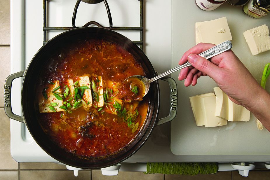 Becky Carman prepared Ben Alexander’s stew using tofu and her own homemade kimchi. Photo by John Jernigan
