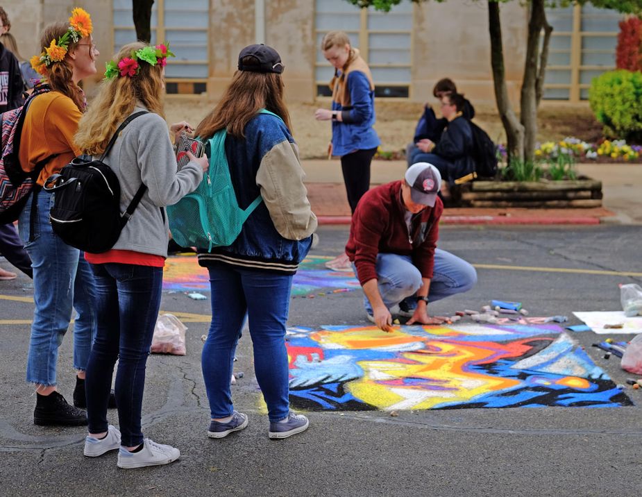Watch beautiful murals emerge beneath your feet at Montmarte, the chalk art festival at the University of Science & Arts of Oklahoma in Chickasha. Photo courtesy University of Science & Arts of Oklahoma