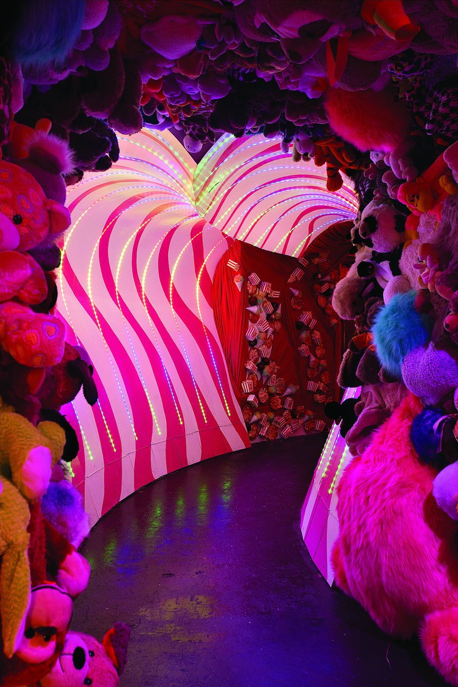 A hundred thirty-six stuffed animals line one of the winding whimsical hallways at Mix-Tape. The group relies on many donated items to create its installations. Photo by John Jernigan.