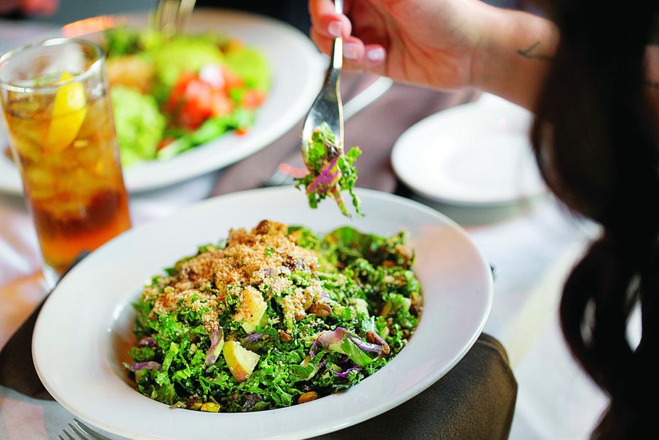 A blend of sweet and savory flavors and contrasting textures makes the Italian Kale Salad at Cheever’s Café a mouthful of fun. Photo by Choate House
