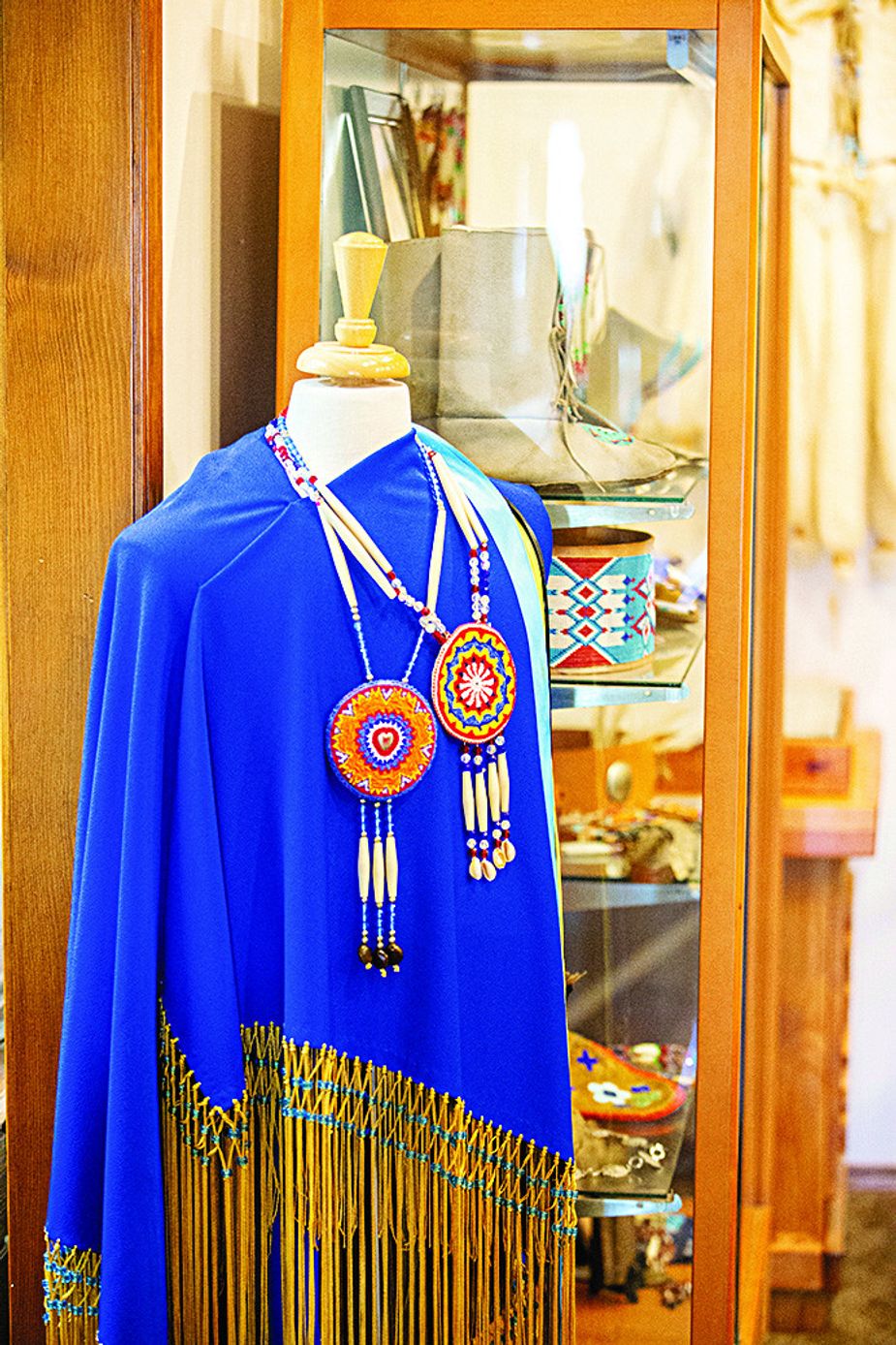 Intriguing items at the Owasso Historical Museum run the gamut from murals to vintage medical supplies to a Kiowa ceremonial dress. Photo by Shane Bevel