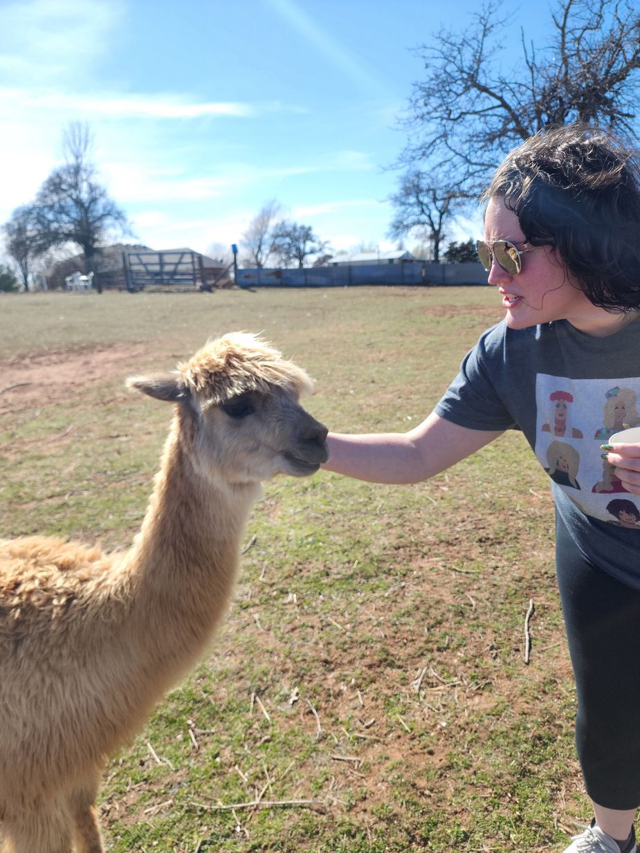 Karlie loves animals of all kinds, but particularly fluffy ones that tolerate being petted. Photo courtesy Lyndsey Coffee